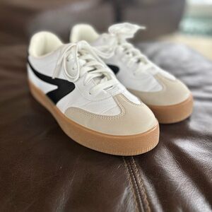 Stylish White and Black Sneakers with Tan Soles